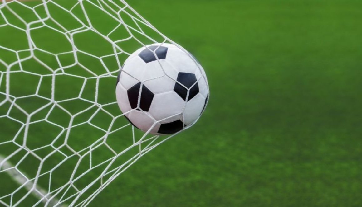 bigstock-Soccer-Ball-In-Goal-96784490